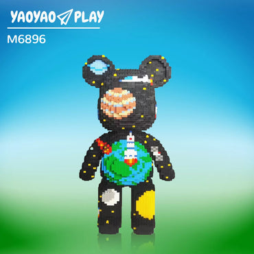 A LEGO-style black Brick Bear toy with cosmic patterns, rocket accents, and branded "YAOYAO PLAY M6896" labeling