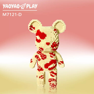 A modular Brick Bear sculpture in off-white and red, labeled "M7121-D," posed against a peach-to-cream gradient with floating reflections.