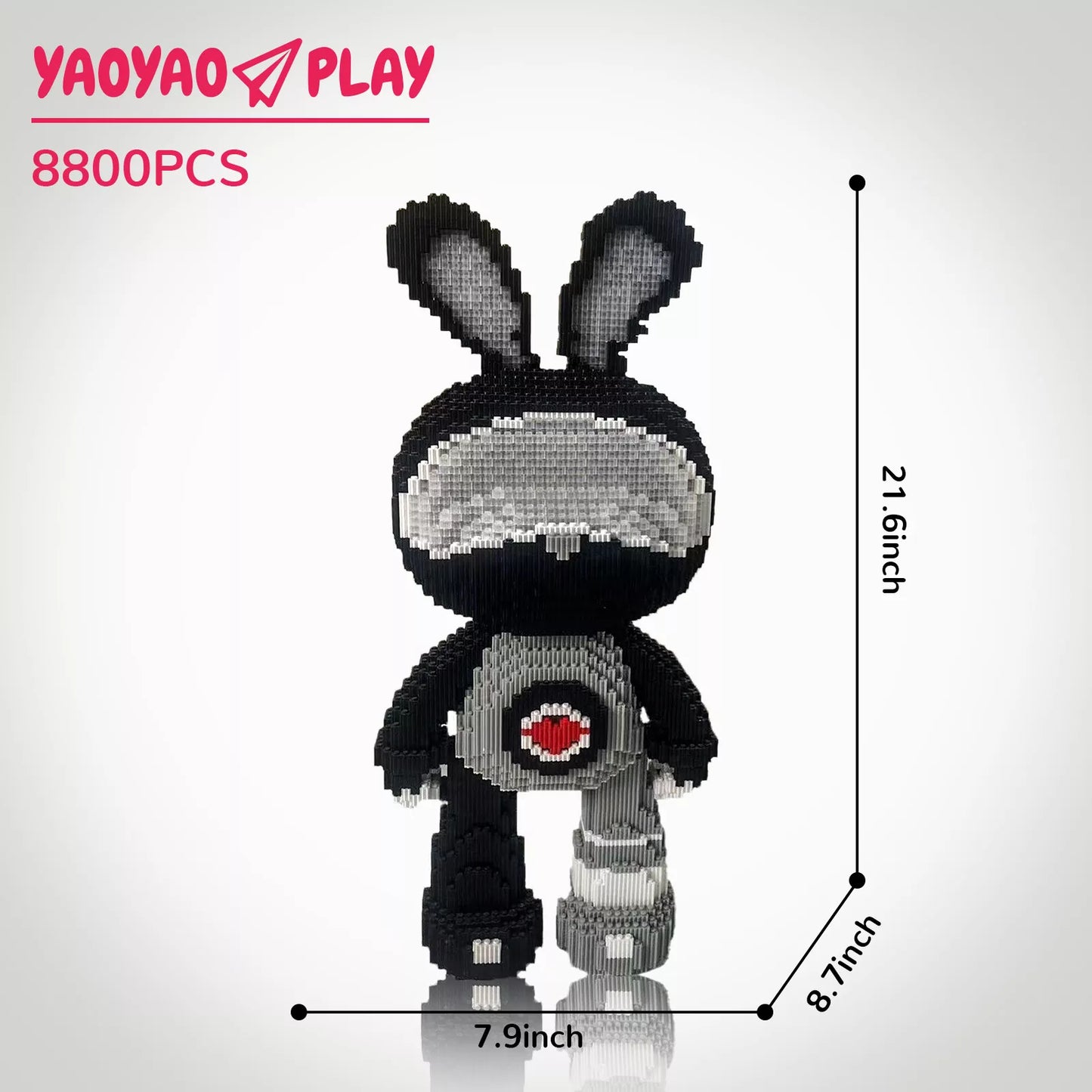 A 21.6-inch-tall monochrome Brick Bear toy companion with heart emblem, labeled "8800PCS" and branded "YAOYAO PLAY."