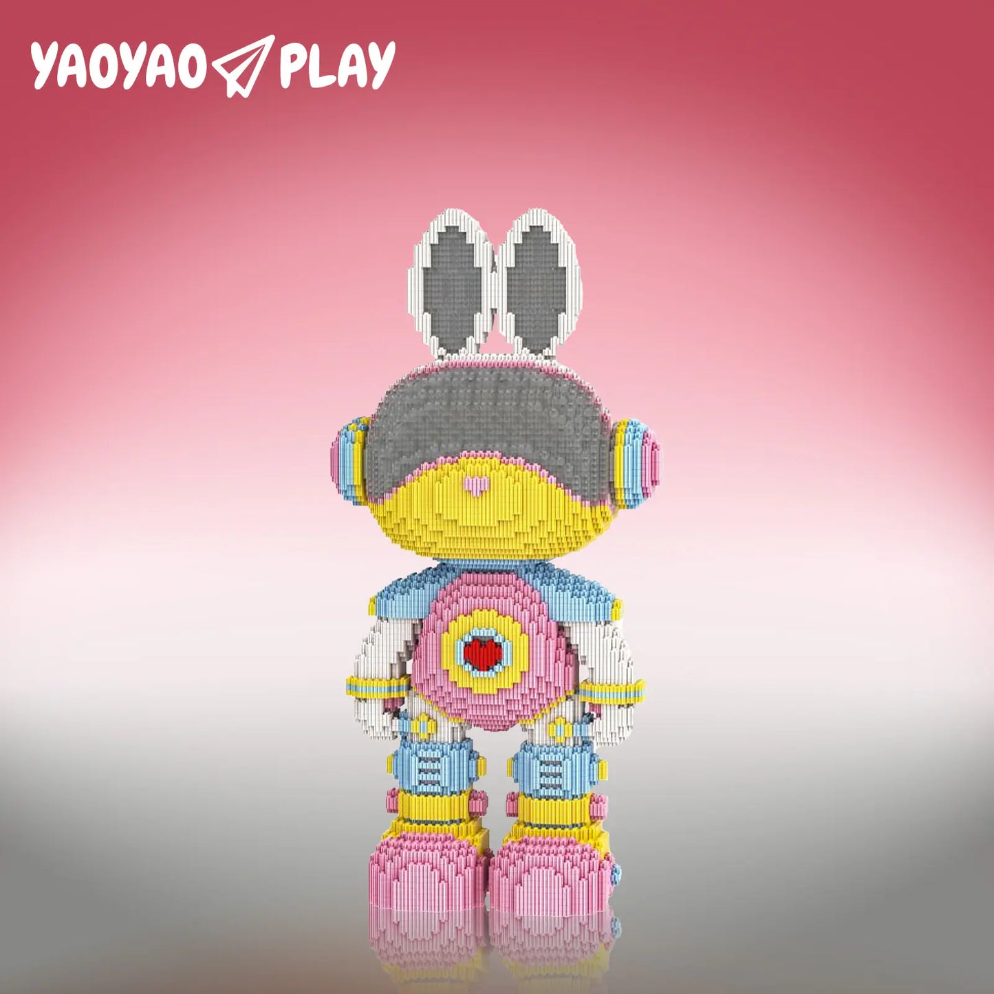 A Brick Bear toy with yellow head, gray helmet, pink heart chest, and blue armor on a pink-white gradient.
