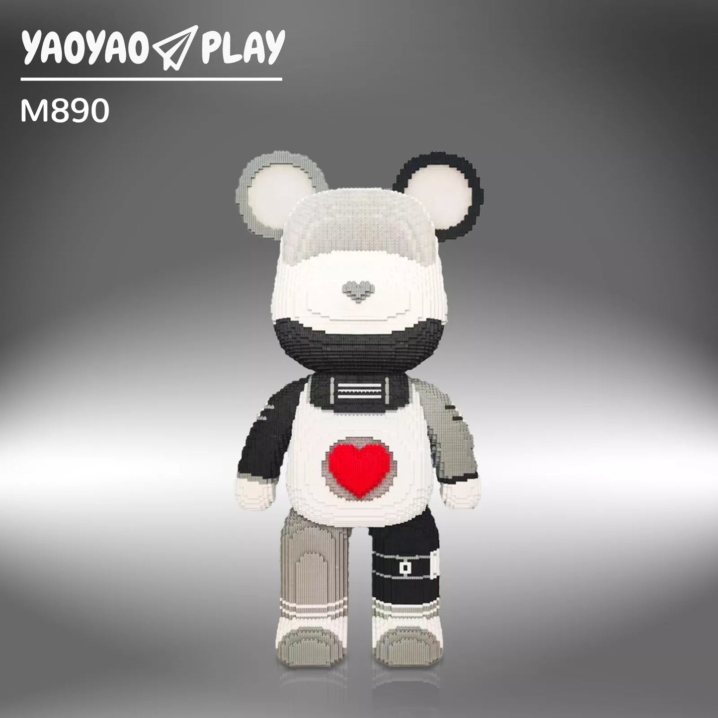 Monochrome Brick Bear toy with red heart and mechanical details against a gradient gray backdrop.