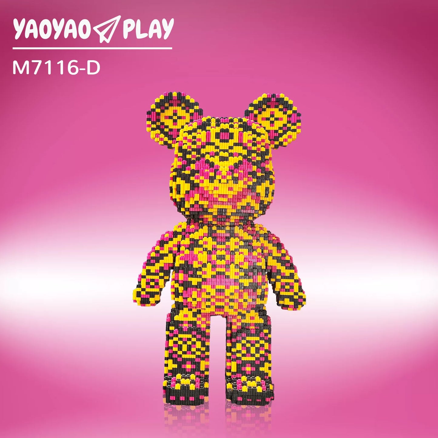A Kumamon-inspired ​​Brick Bear toy​​ with yellow, pink, and black pixel blocks, model "M7116-D," on a gradient pink backdrop