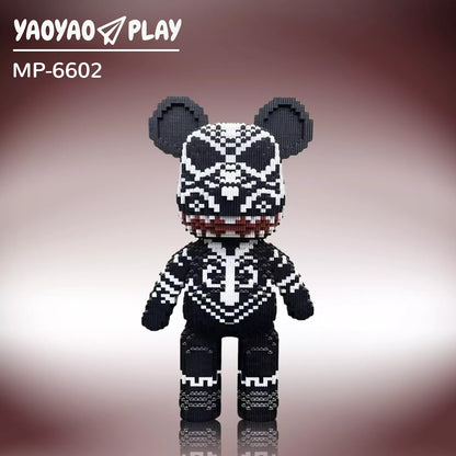 A black-and-white ​​Brick Bear toy​​ (Model MP-6602) with red-accented mouth and geometric patterns on a burgundy gradient.